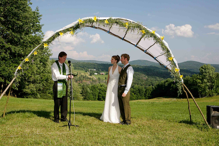 Wedding arbor built with saplings and cotton sheets on site