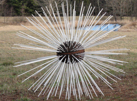 Seed, fiberglass wands and burned wood, 6’ diameter